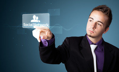 Businessman pressing modern social type of icons