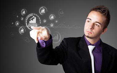 Businessman pressing modern business type of buttons