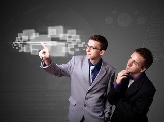 Businessman pressing high tech type of modern buttons