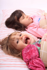Obraz na płótnie Canvas Little girls waking up