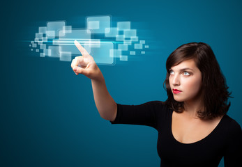 Businesswoman pressing high tech type of modern buttons