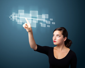 Businesswoman pressing high tech type of modern buttons