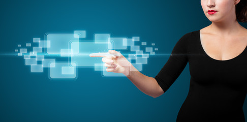 Businesswoman pressing high tech type of modern buttons