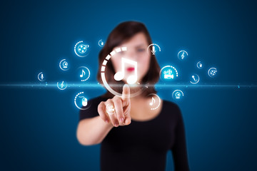 Businesswoman pressing virtual media type of buttons