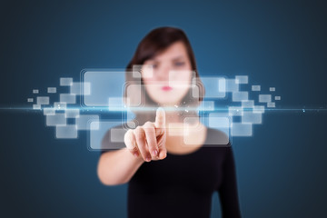 Businesswoman pressing high tech type of modern buttons