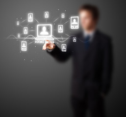 Businessman pressing modern social type of icons