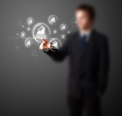 Businessman pressing modern business type of buttons