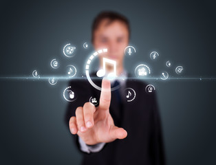 Businessman pressing virtual media type of buttons