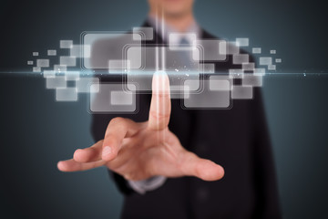 Businessman pressing high tech type of modern buttons