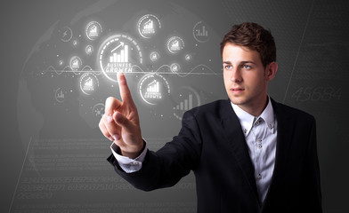 Businessman pressing modern business type of buttons