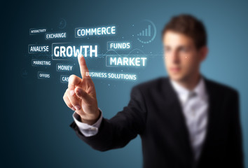 Businessman pressing modern business type of buttons