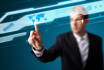 Businessman pressing high tech type of modern buttons