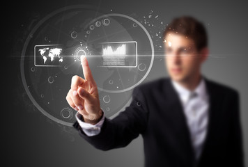 Businessman pressing high tech type of modern buttons