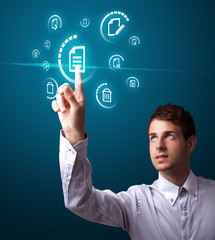 Businessman pressing virtual messaging type of icons
