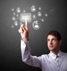 Businessman pressing modern business type of buttons