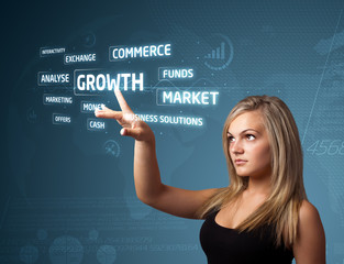 Businesswoman pressing modern business type of buttons