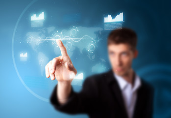 Businessman pressing high tech type of modern buttons