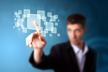Businessman pressing high tech type of modern buttons