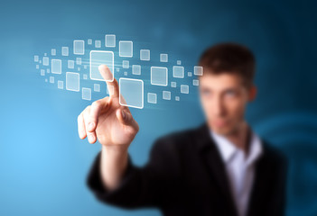 Businessman pressing high tech type of modern buttons
