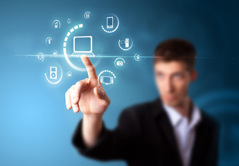 Businessman pressing virtual media type of buttons