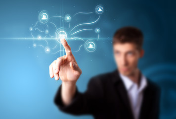 Businessman pressing modern social type of icons