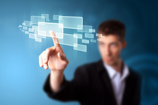 Businessman pressing high tech type of modern buttons