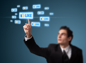 Businessman pressing modern social type of icons