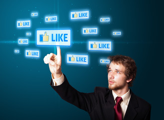 Businessman pressing modern social type of icons