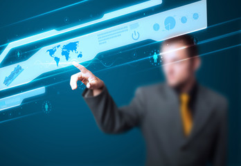 Businessman pressing high tech type of modern buttons