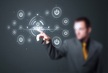 Businessman pressing simple type of start buttons