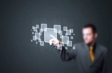 Businessman pressing high tech type of modern buttons