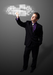 Businessman pressing high tech type of modern buttons