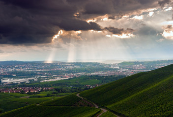 Cloudy stormy sky with sun ray breaking through