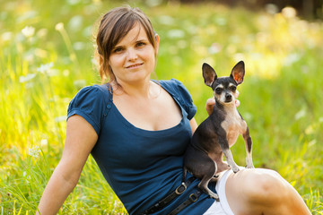 Young woman and her chihuahua dog