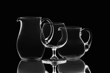 Two empty jugs and one wineglass