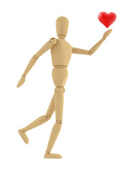 Wooden mannequin holds a heart. Isolated on white.