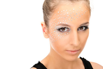 Portrait of young beautiful woman with crystals on face - isolat