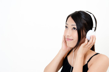 Fototapeta premium attractive asian woman listening music