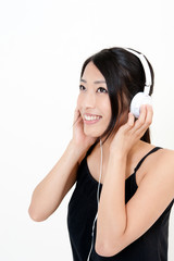 attractive asian woman listening music