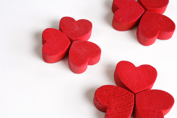 Red wooden hearts on white