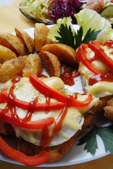 pork chop with cheese and roasted potatoes