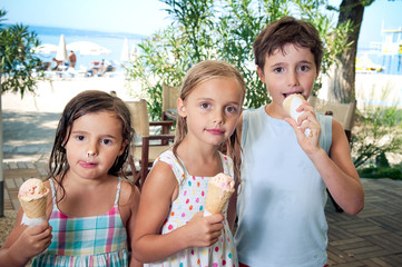 Three kids eating ice cream