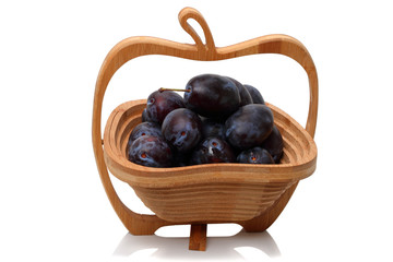 Wooden vase with black plum
