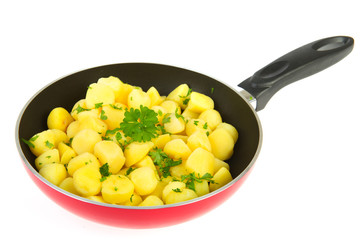Red frying pan new potatoes