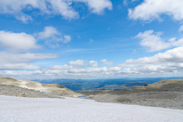 Fototapeta na wymiar blue sky and white clouds over landscape in Norway