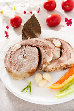 sliced beef roll on a plate