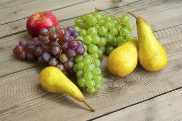 apples grapes and pears, wooden table