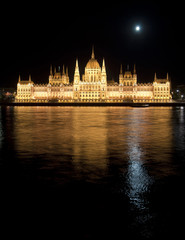 Fototapeta premium Hungarian parliament with Moon at night, Budapest