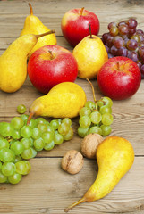 apples grapes and pears, wooden table