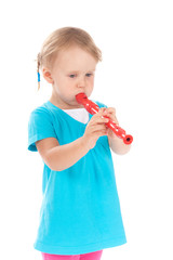 Child in the studio playing the flute © Rachwalski